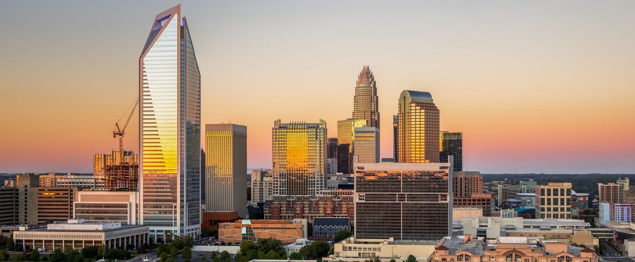 The Charlotte, North Carolina skyline seen during sunset on a colorful clear afternoon. 