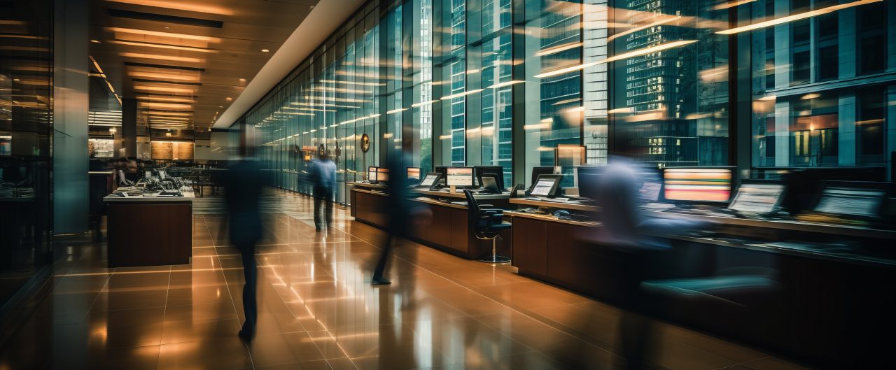 Blurred bokeh effect in a busy banking hall with teller windows and customer interactions