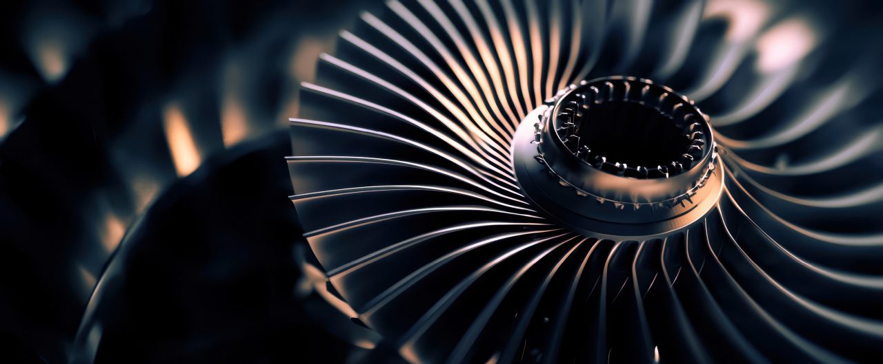 Close-up of a turbine engine, showcasing intricate details and metallic textures