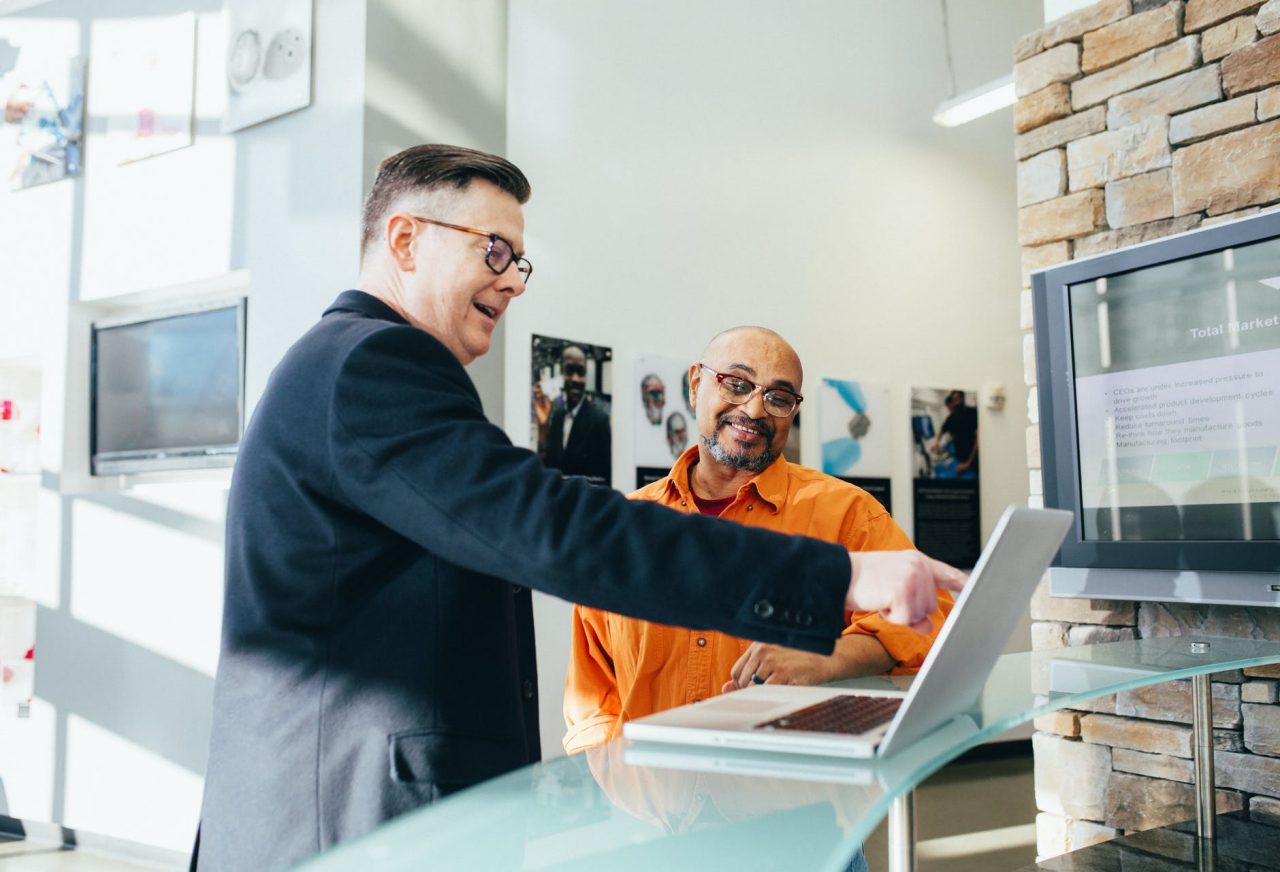 Two Colleagues Looking at a Laptop