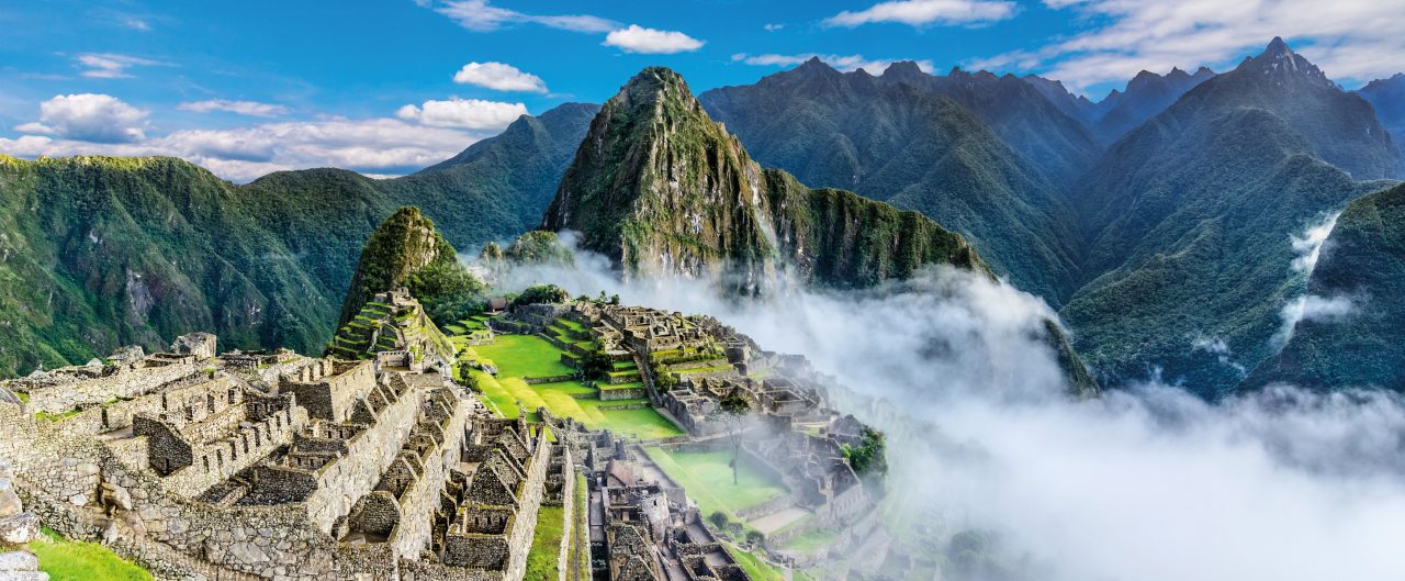 Overview of Machu Picchu, agriculture terraces and Wayna Picchu peak in the background