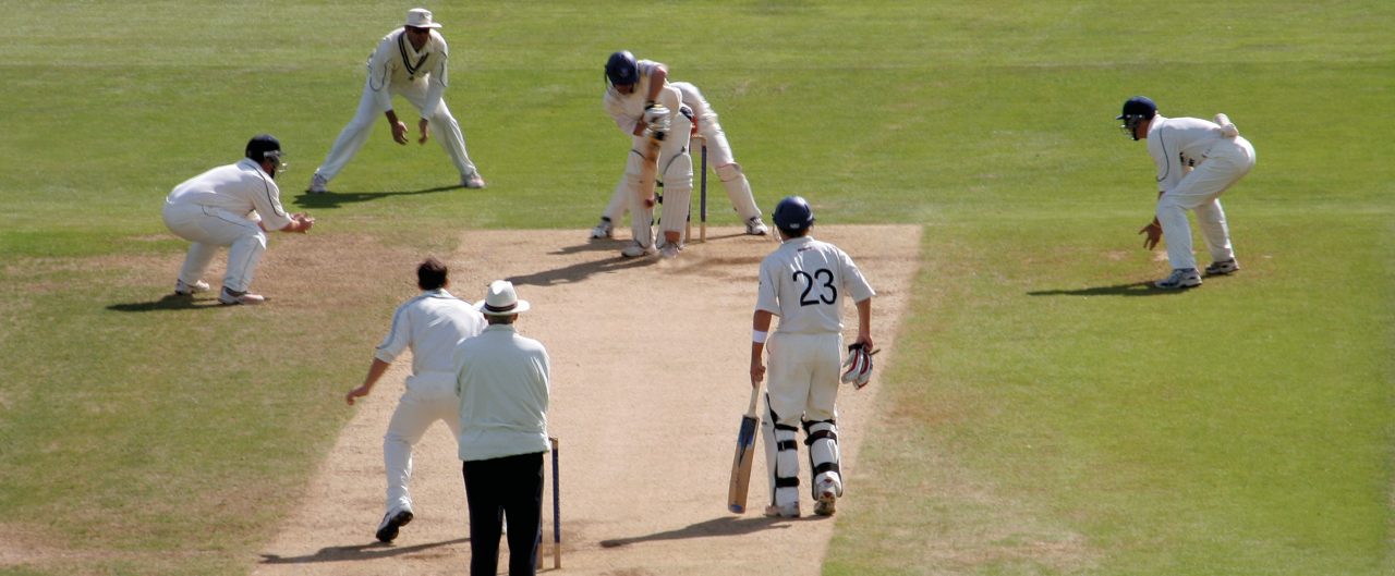 Cricketers playing in a cricket match