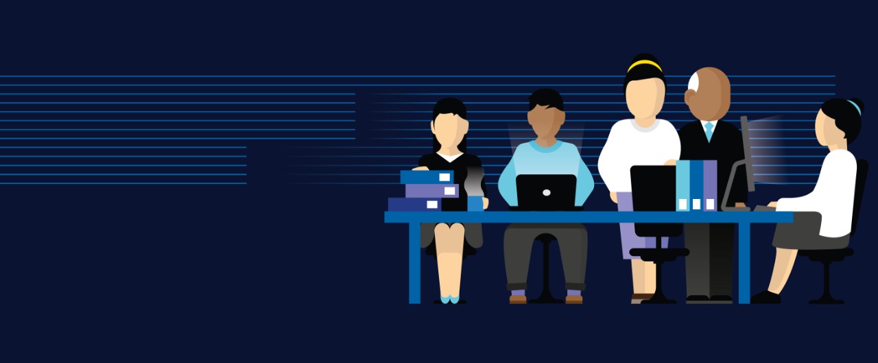 Multi-generational family working on laptops together at a table