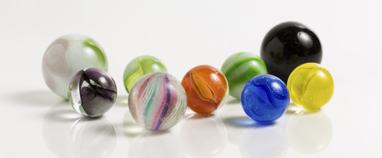 Nine different coloured marbles