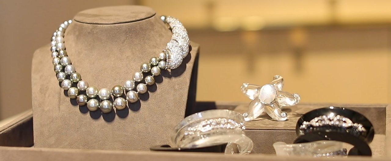 Necklace, ring, and two bracelets on display