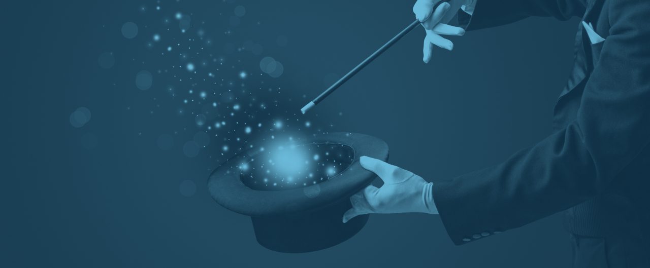 A magician holding a magic wand over a hat iwith flares of light coming out of it.