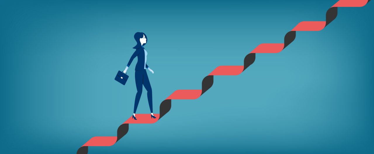 Businesswoman walking up staircase