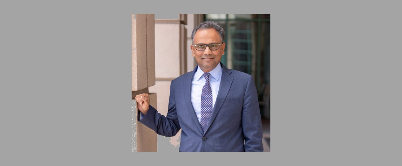 picture of Rajiv Jain in business suite outside a building