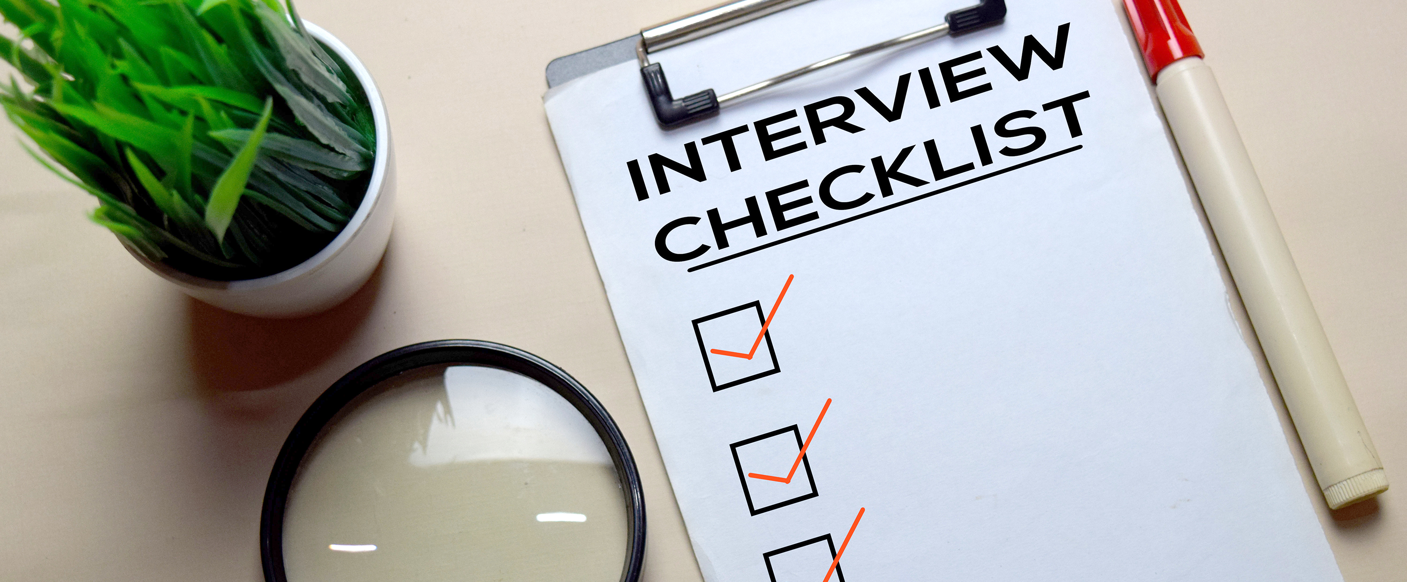 Interview Checlist write on a paperwork isolated on office desk.