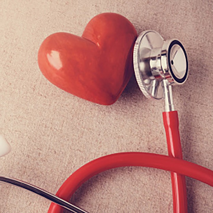 A red heart next to a stethoscope