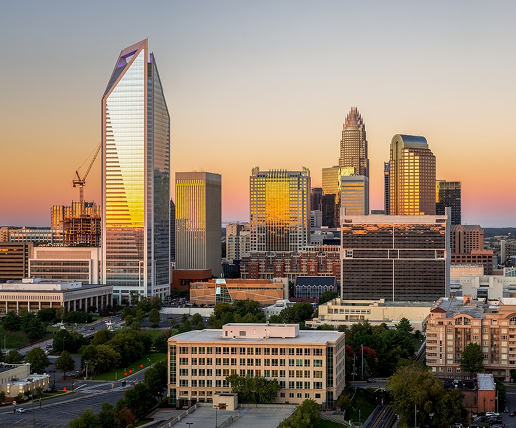 The Charlotte, North Carolina skyline seen during sunset on a colorful clear afternoon. 