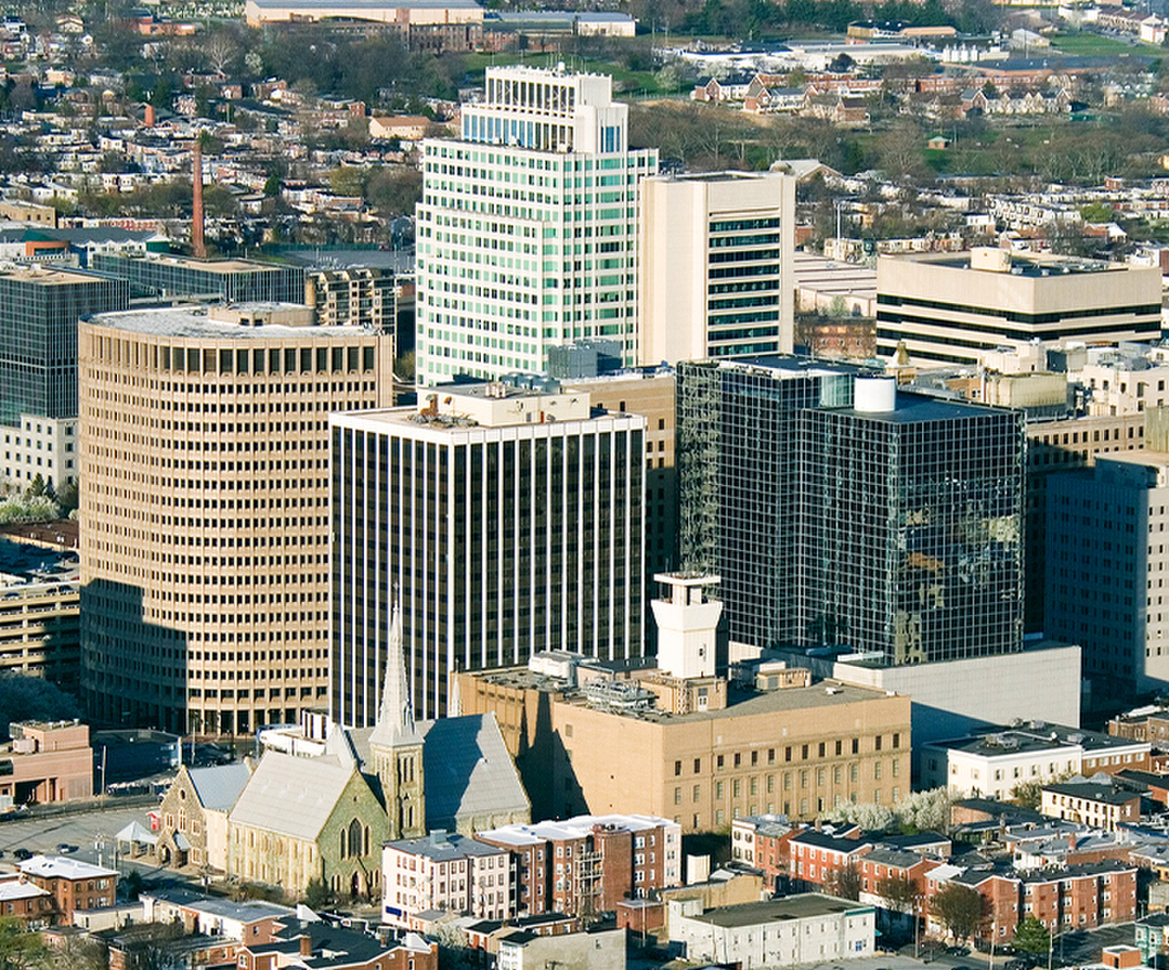 Wilmington, Delaware city aerial view with short brown town houses alongside skyscrapers