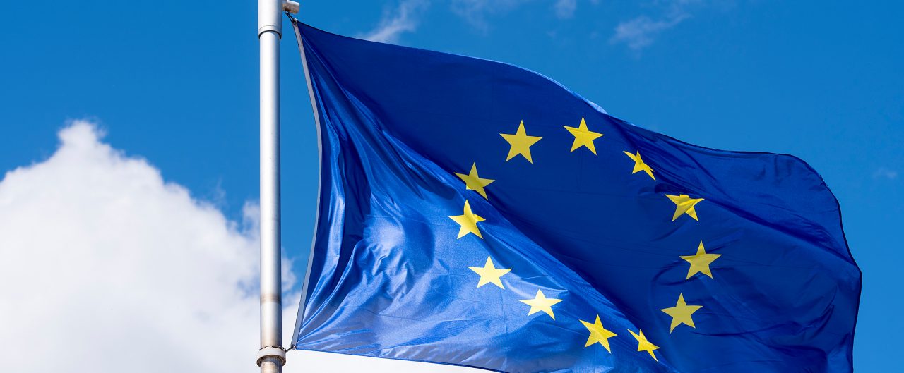 EU Flag waving against blue sky