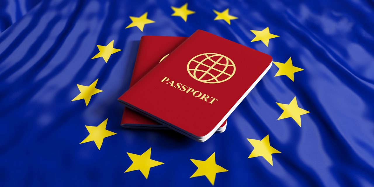 Two red passports on European Union flag
