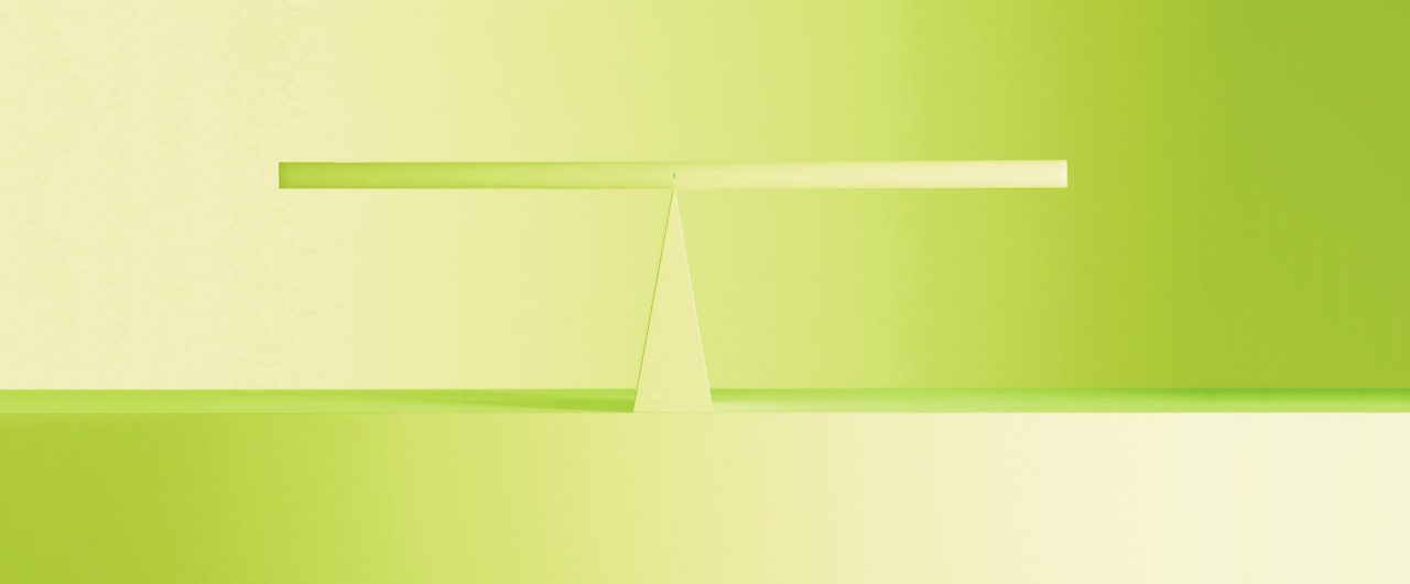 A light green balance figure on a lime green background.