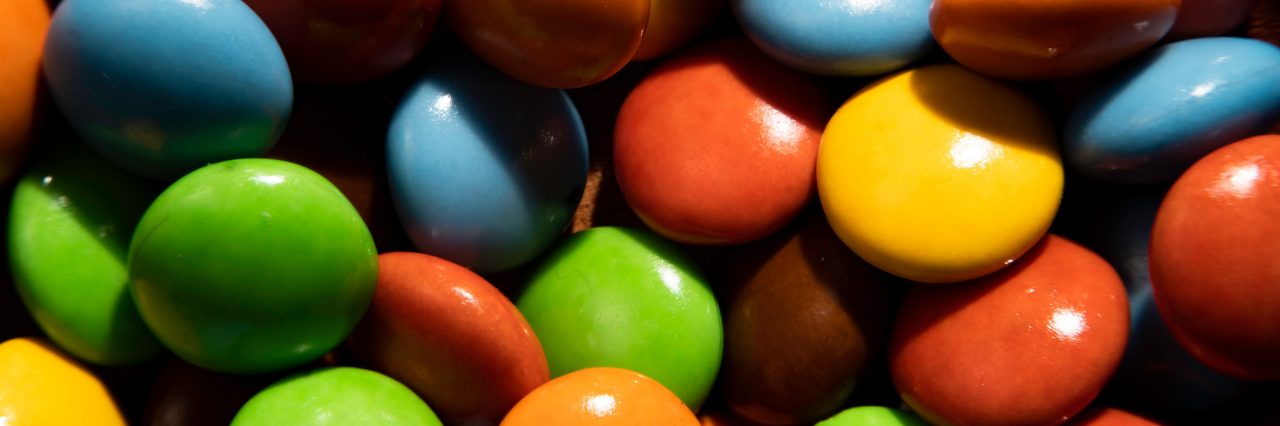 Many colourful candy filling background.