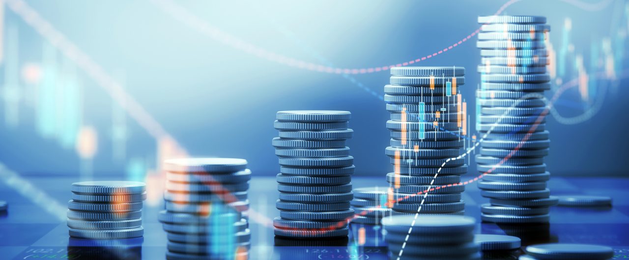stack of coins on tech blue background