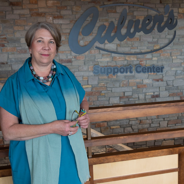 Lea Culver in front of Culver Suppor Center