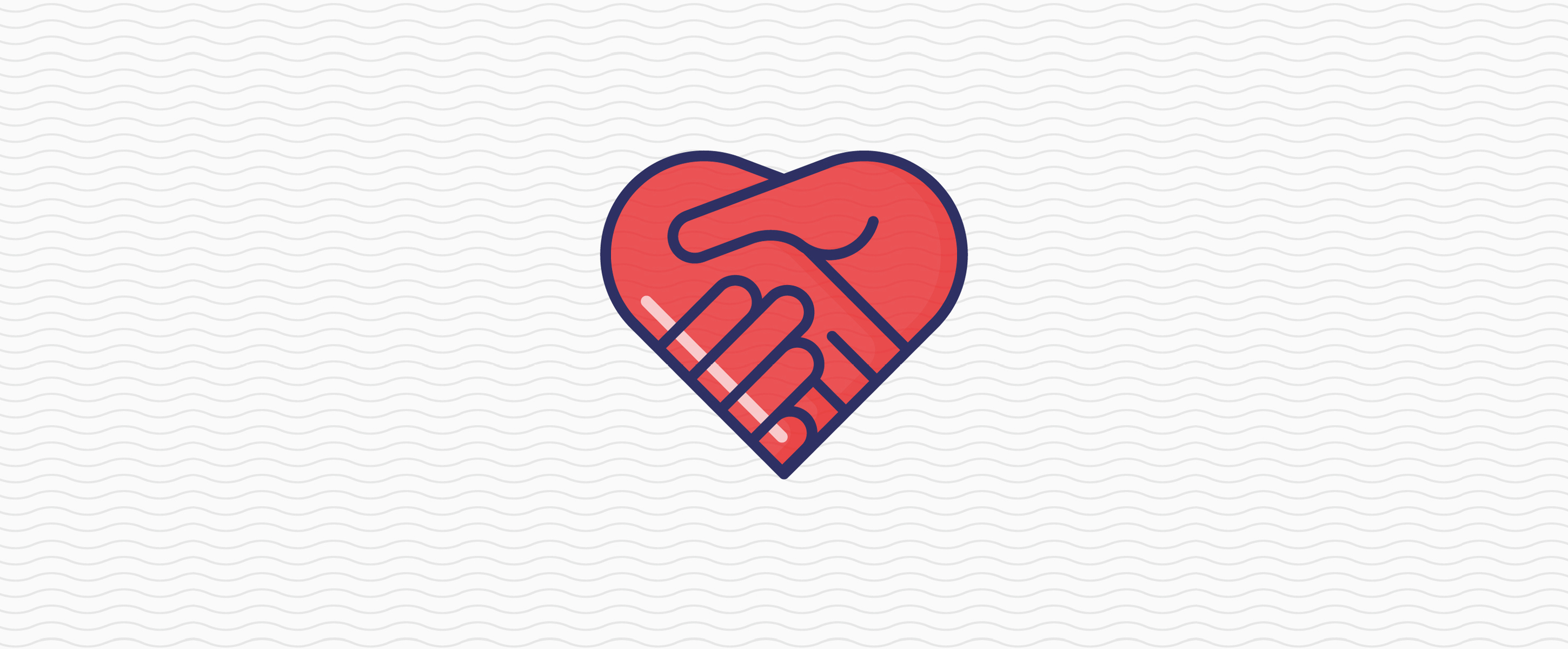 A pair of hands shaking in the shape of a heart