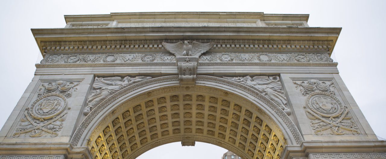 Upward View of Washington Square Monument on Cloudy Day