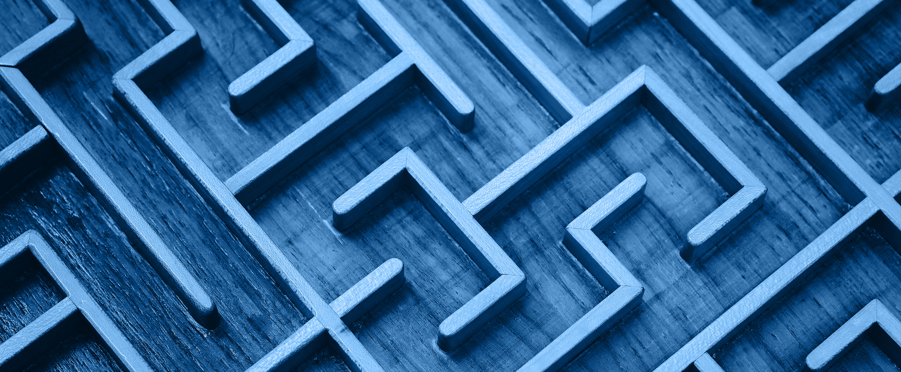 Close up of blue toned wooden maze