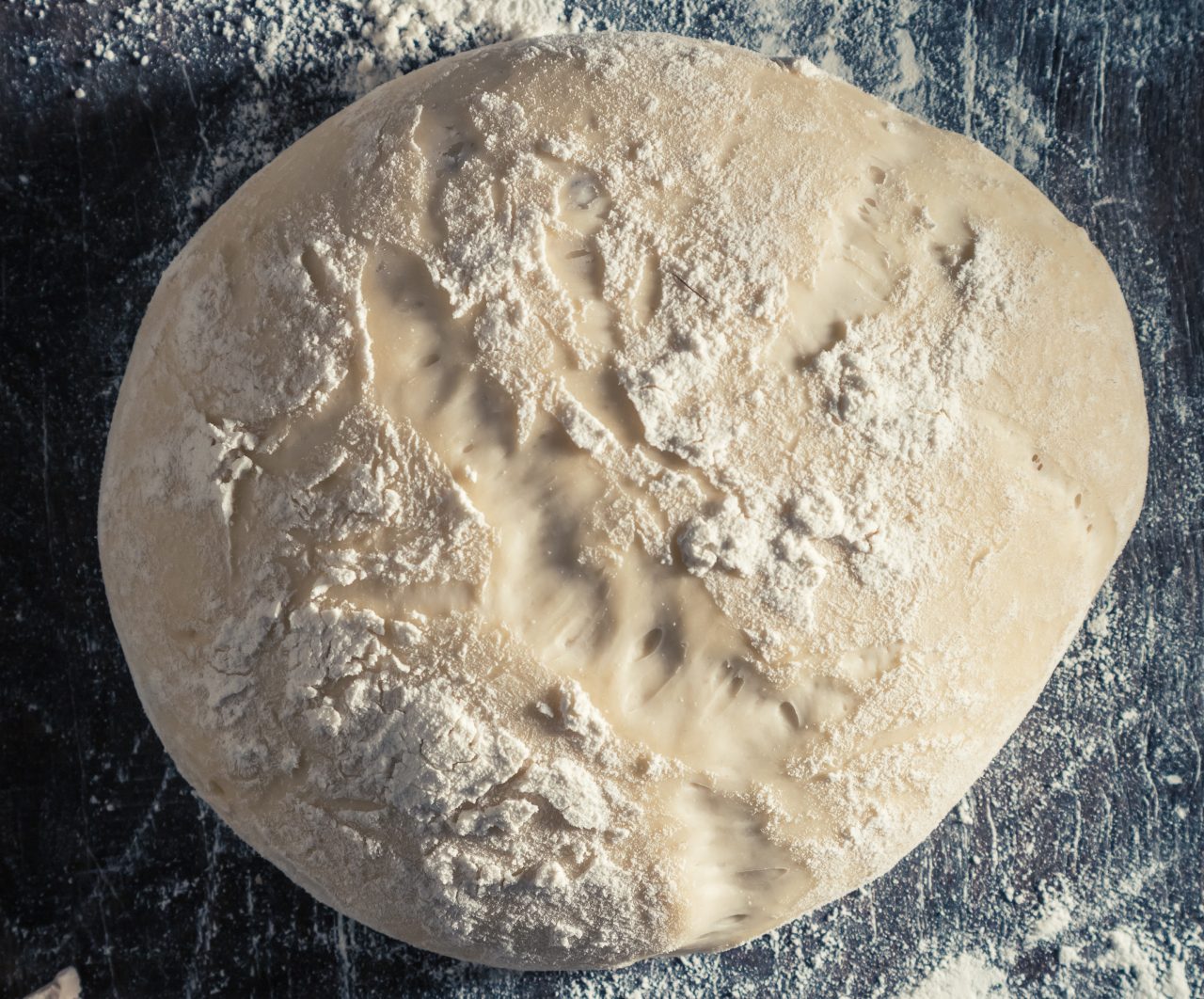 fresh dough on floured wooden surface