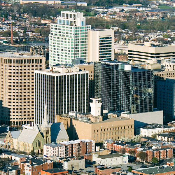 Wilmington, Delaware city aerial view with short brown town houses alongside skyscrapers