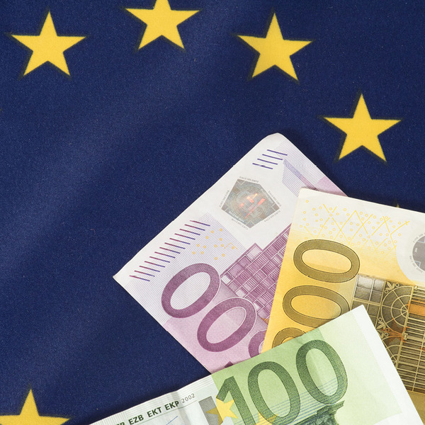 Euro bills placed on EU Flag