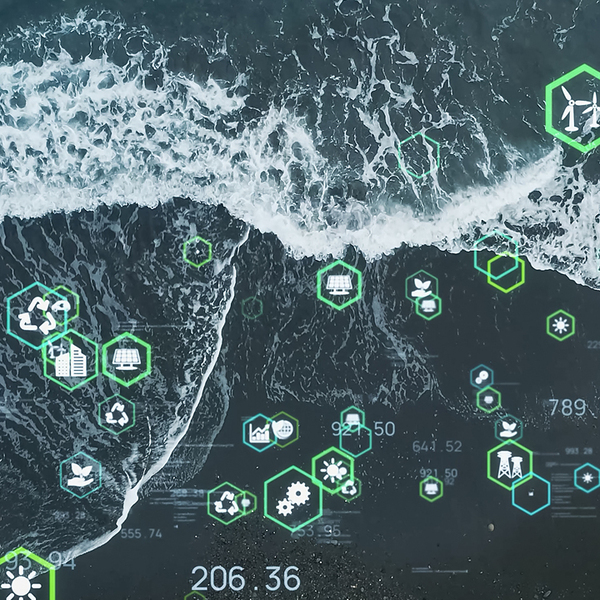 Birds eve view of the sea with abstract ESG icons and numbers featured over the top