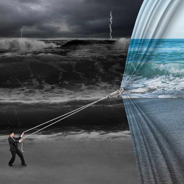 businessman pulling open calm sea curtain covered dark stormy ocean background