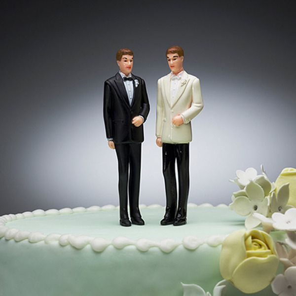 Two grooms on a wedding cake 