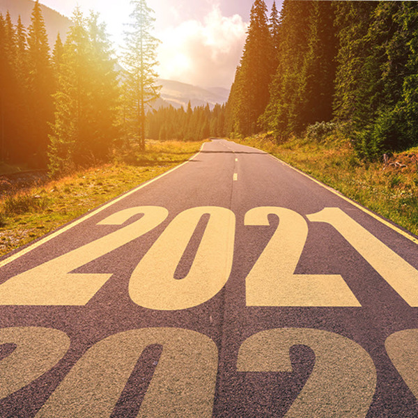 looking down a road with trees on side, the year 2020 and 2021 written on road