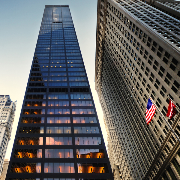 Photo of office building with sky in the background.