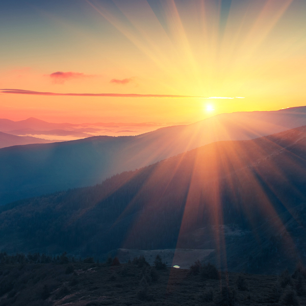 Panoramic view of  colorful sunrise in mountains. 