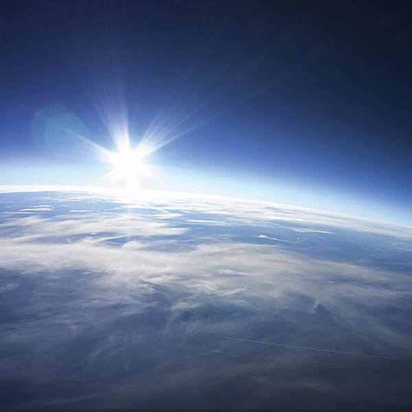planet earth from space with sun rising
