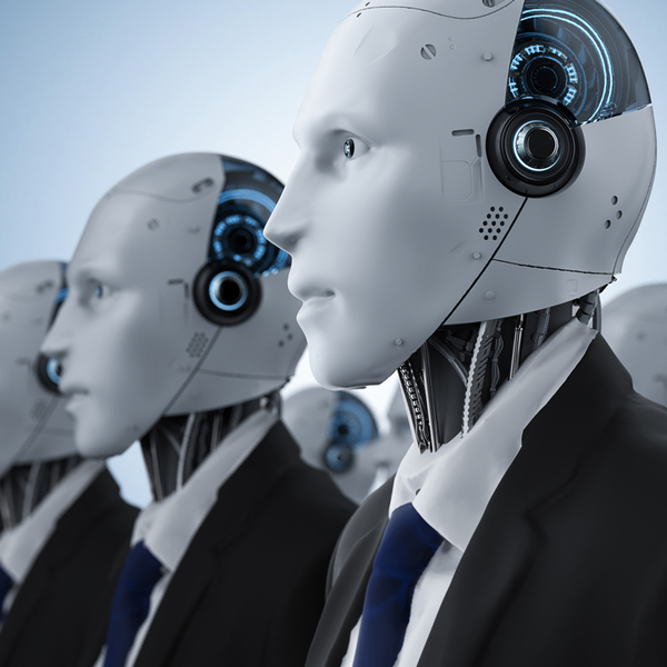 Humanoid robots dressed as businessmen