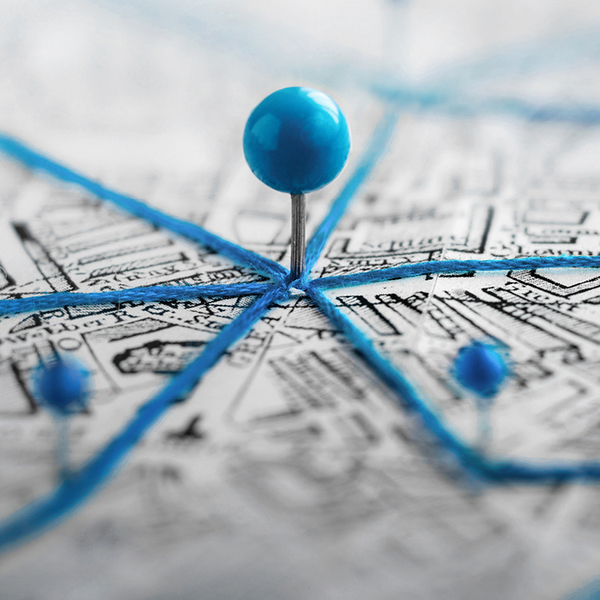 Location marking with a pin on a map with routes