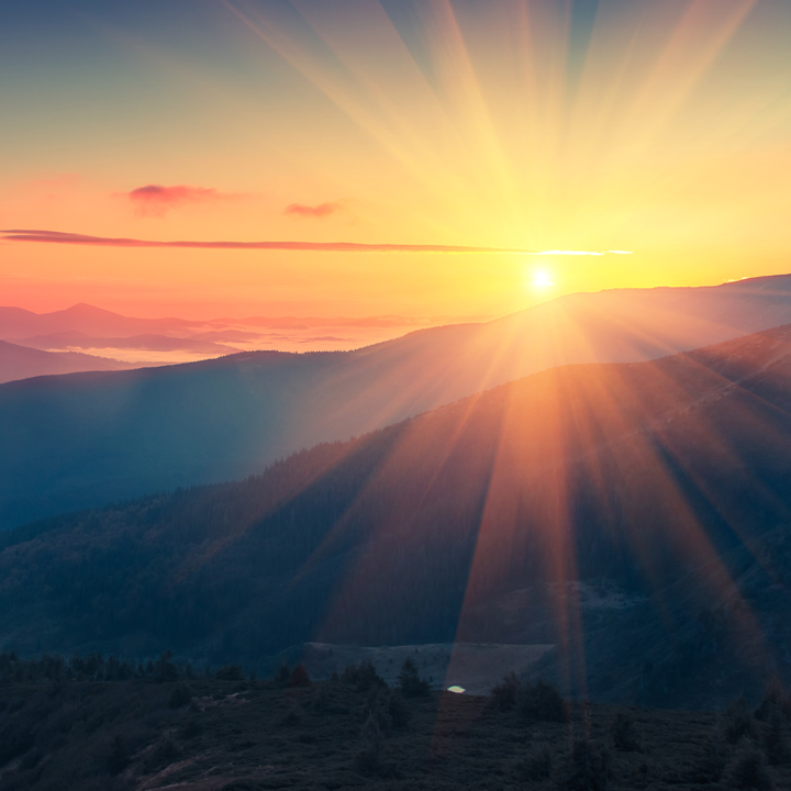 Panoramic view of  colorful sunrise in mountains. 
