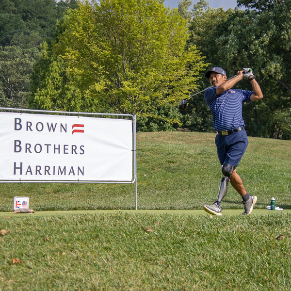 golfers at Simpson Cup with BBH sign