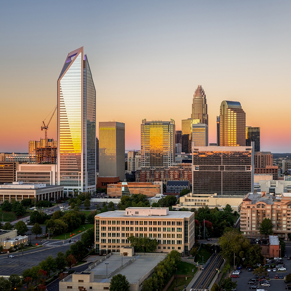 The Charlotte, North Carolina skyline seen during sunset on a colorful clear afternoon. 