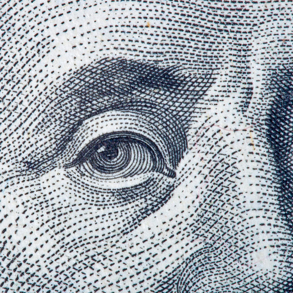 Benjamin Franklin's eye close-up from one hundred dollar bill