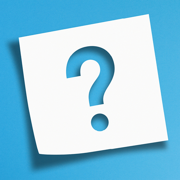 Question mark shape cut out in a white post-it-note on a blue gradient background