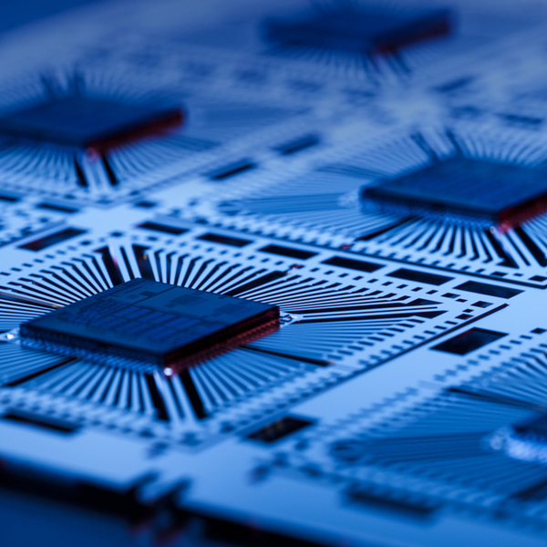 Close-up of Silicon Dies Attached to Substrate on During Microchip Production Process at a Semiconductor Factory. Computer Chip Manufacturing at a Fab.