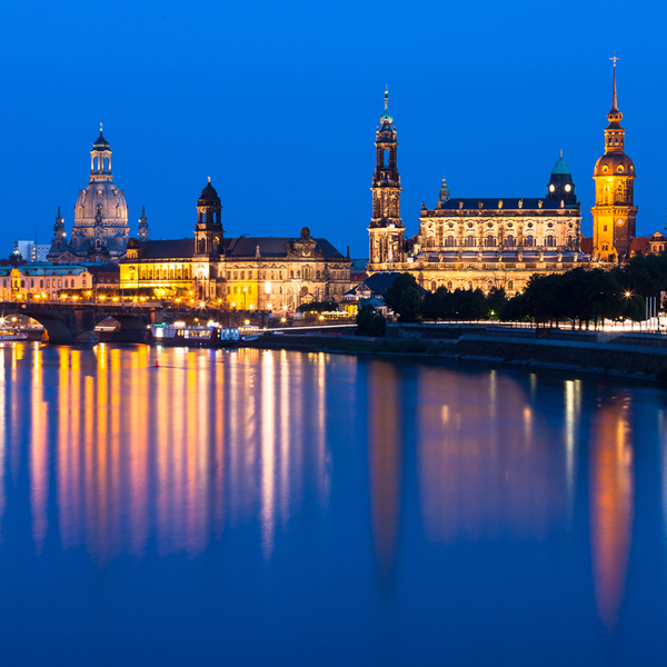 Dresden old town skyline along the Elbe river with reflection during evening twilight. Germany.