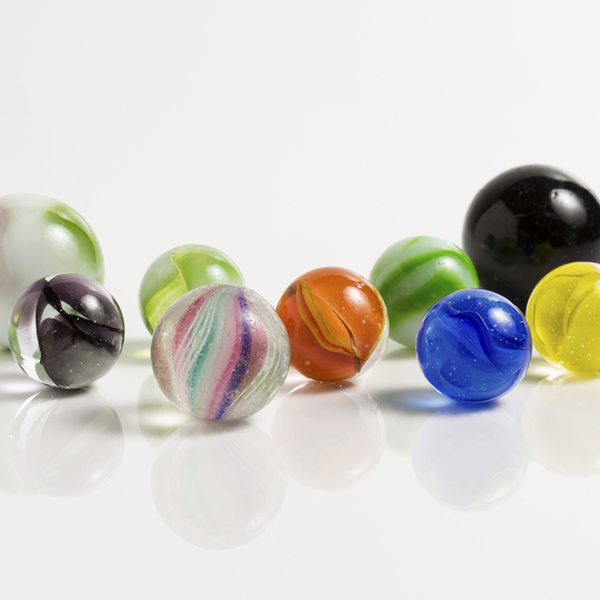Nine different coloured marbles
