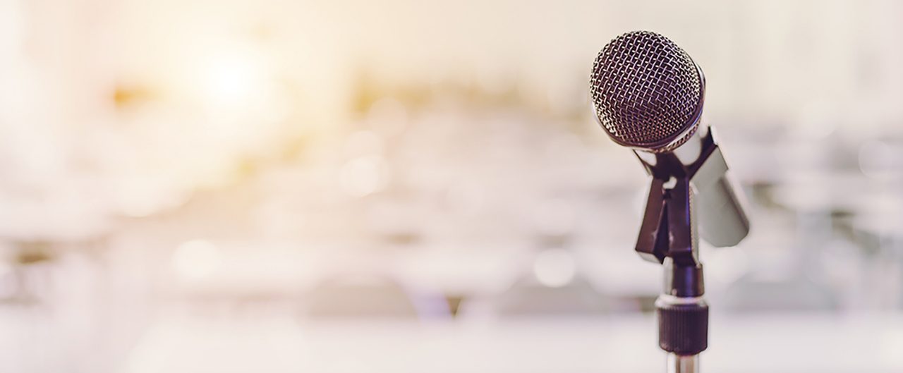 Microphone in Blurry Conference Room