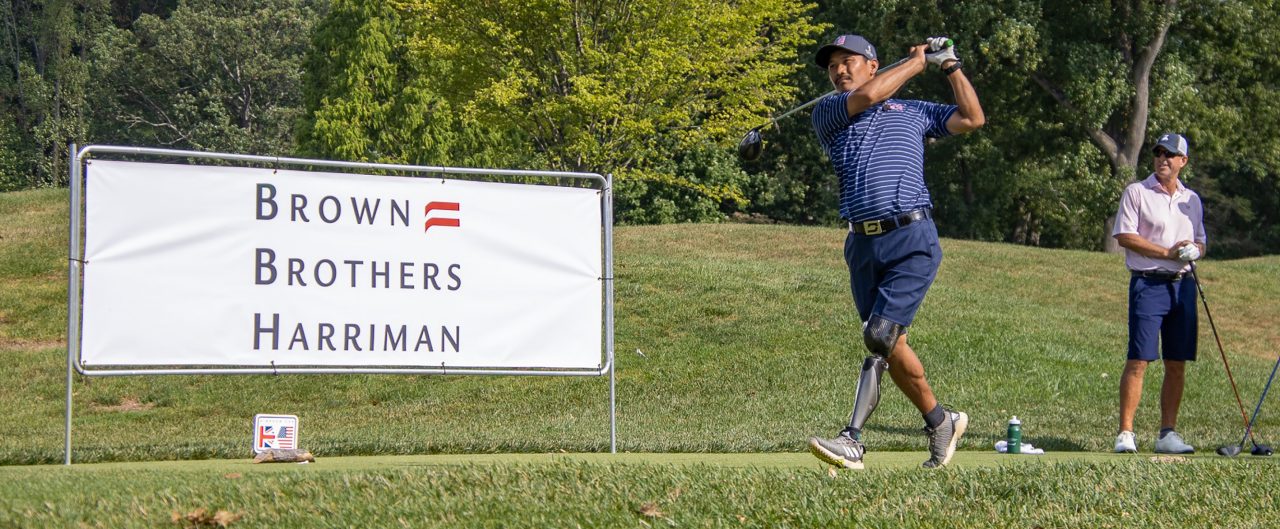 golfers at Simpson Cup with BBH sign