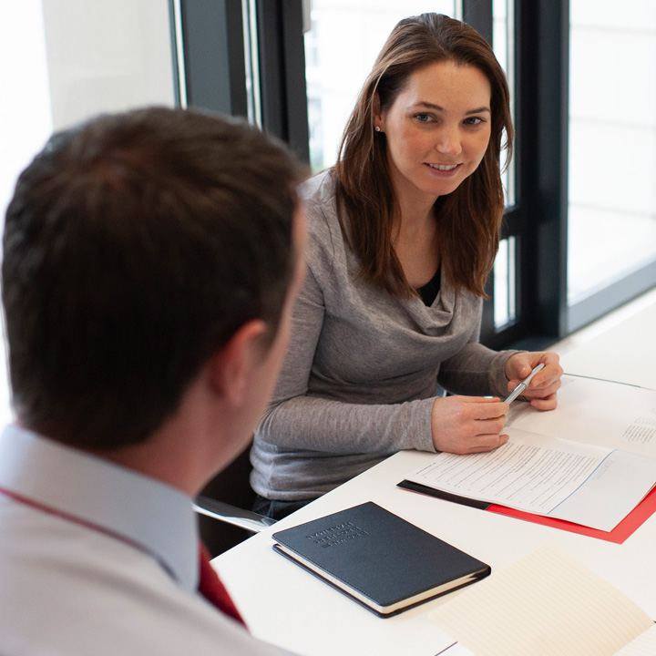 Two BBH employees in conference room