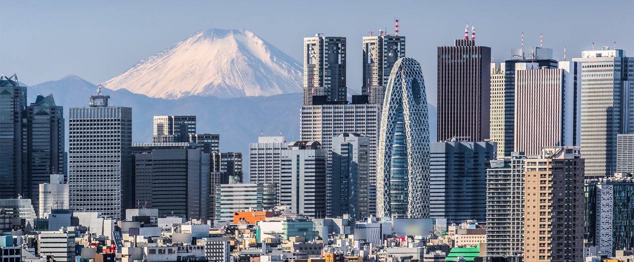 High building at Tokyo shinjuku and Mt. Fuji with snowy mountain in the background