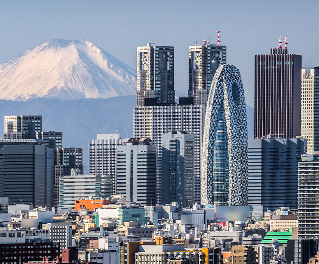 High building at Tokyo shinjuku and Mt. Fuji with snowy mountain in the background